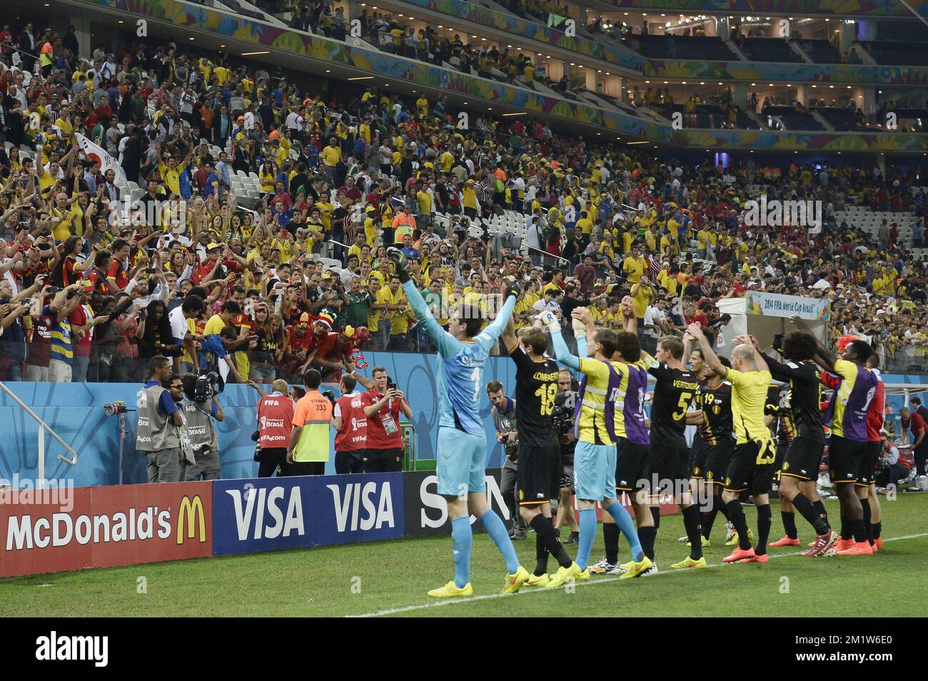 20140626 - SAO PAULO, BRAZIL: Belgium's goalkeeper Thibaut Courtois and players celebrate and thank supporters after the victory 0-1 at the match between Belgian national soccer team Red Devils and South-Korea, third match in group H, in the stadium 'Arena de Sao Paulo', in Itaquera, Sao Paulo, Brazil, during the 2014 FIFA World Cup, Thursday 26 June 2014. The Red Devils lead their group H with two victories. BELGA PHOTO DIRK WAEM Stock Photo