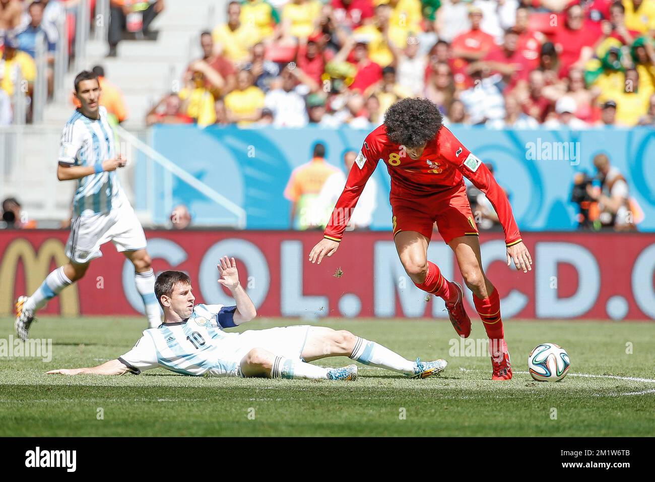 Argentina's Lionel Messi and Belgium's Marouane Fellaini fight for the ball during the quarter final match between Belgian national soccer team Red Devils and Argentina, in Estadio Nacional Mane Garrincha, in Brasilia, Brazil, during the 2014 FIFA World Cup, Saturday 05 July 2014. BELGA PHOTO BRUNO FAHY Stock Photo