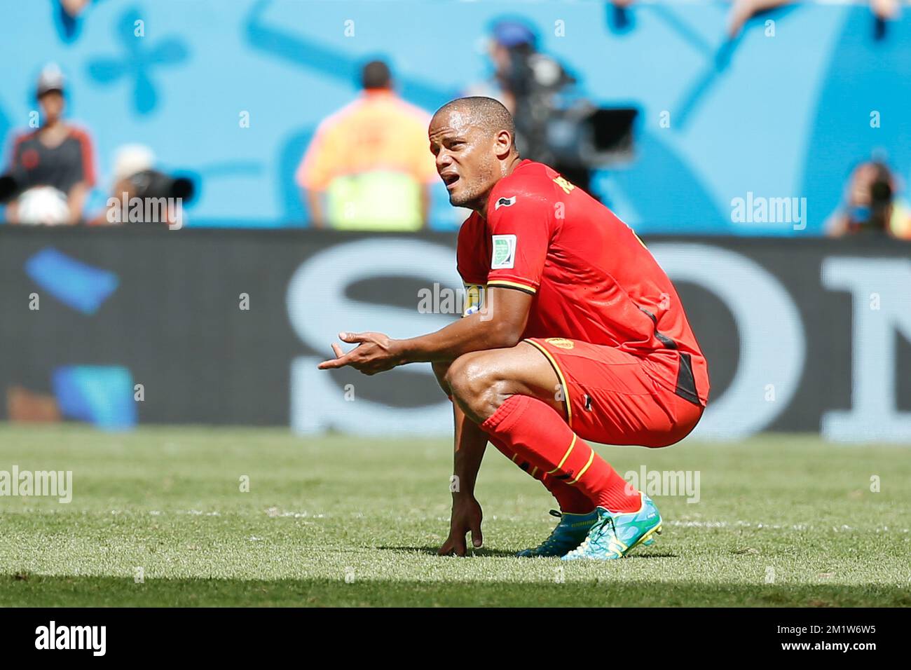 Belgium's captain Vincent Kompany looks dejected during the quarter final match between Belgian national soccer team Red Devils and Argentina, in Estadio Nacional Mane Garrincha, in Brasilia, Brazil, during the 2014 FIFA World Cup, Saturday 05 July 2014. BELGA PHOTO BRUNO FAHY Stock Photo