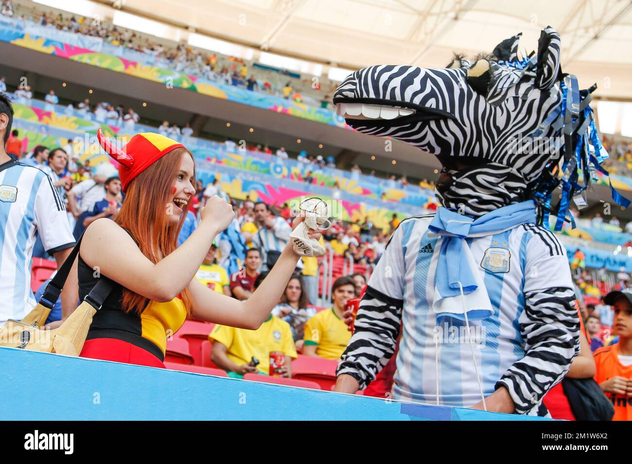 Red Devils' supporter and Argentinian Zebra mascot pictured prior to the quarter final match between Belgian national soccer team Red Devils and Argentina, in Estadio Nacional Mane Garrincha, in Brasilia, Brazil, during the 2014 FIFA World Cup, Saturday 05 July 2014. BELGA PHOTO BRUNO FAHY Stock Photo