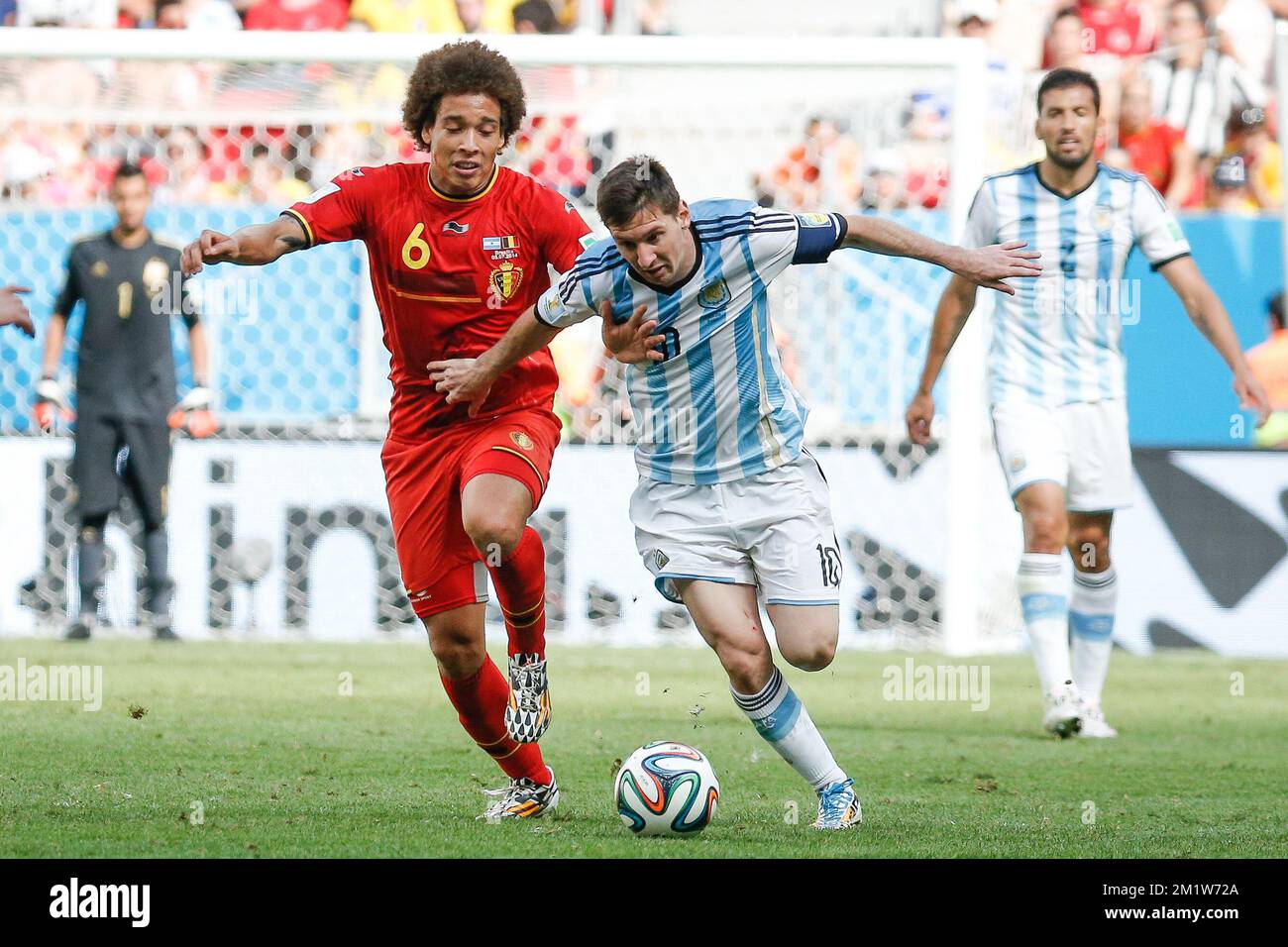 Belgium's Axel Witsel and Argentina's Lionel Messi fight for the ball during the quarter final match between Belgian national soccer team Red Devils and Argentina, in Estadio Nacional Mane Garrincha, in Brasilia, Brazil, during the 2014 FIFA World Cup, Saturday 05 July 2014.  Stock Photo