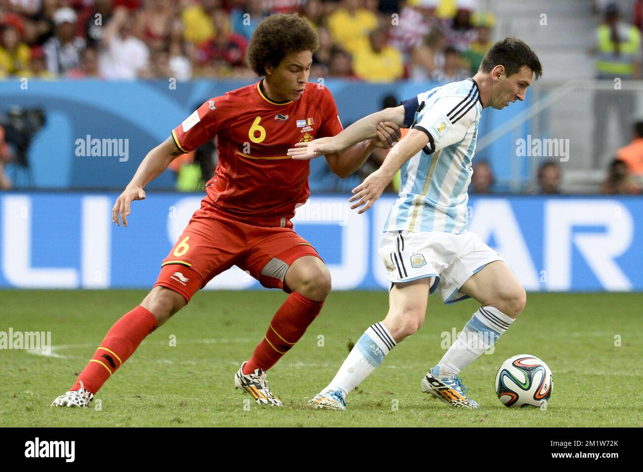 Argentina's Lionel Messi and Belgium's Axel Witsel fight for the ball during the quarter final match between Belgian national soccer team Red Devils and Argentina, in Estadio Nacional Mane Garrincha, in Brasilia, Brazil, during the 2014 FIFA World Cup, Saturday 05 July 2014.  Stock Photo