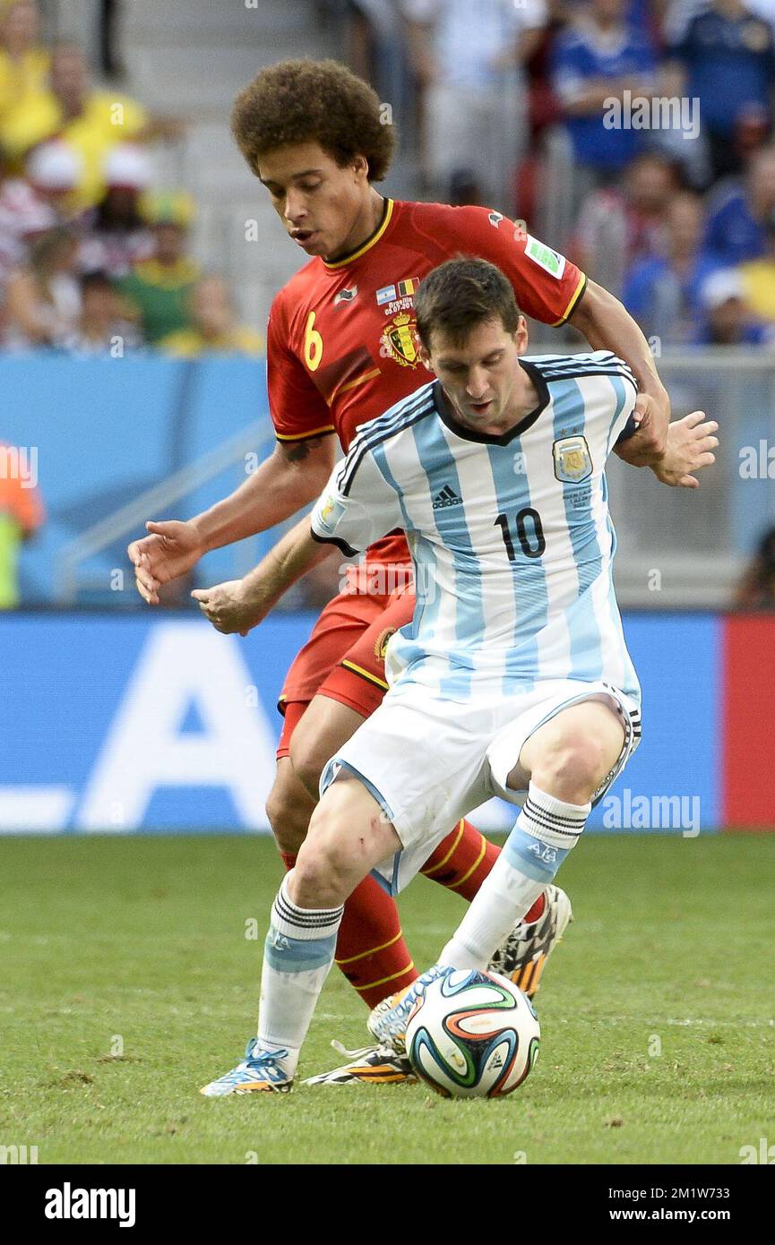 Argentina's Lionel Messi and Belgium's Axel Witsel fight for the ball during the quarter final match between Belgian national soccer team Red Devils and Argentina, in Estadio Nacional Mane Garrincha, in Brasilia, Brazil, during the 2014 FIFA World Cup, Saturday 05 July 2014.  Stock Photo