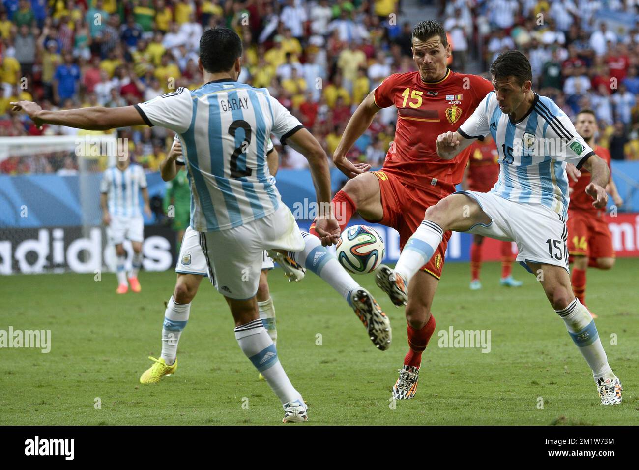 Argentina's Ezequiel Garay, Belgium's Daniel Van Buyten and Argentina's Martin Demichelis fight for the ball during the quarter final match between Belgian national soccer team Red Devils and Argentina, in Estadio Nacional Mane Garrincha, in Brasilia, Brazil, during the 2014 FIFA World Cup, Saturday 05 July 2014.  Stock Photo