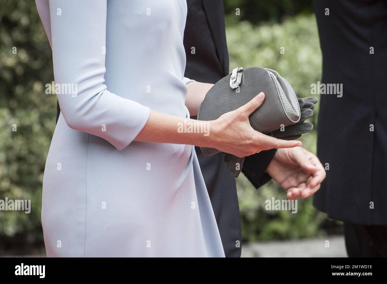 Illustration shows a close up on the hands of Queen Mathilde holding her purse and goves at the reception of the guests attending a ceremony for the 100th anniversary of the First World War, Monday 04 August 2014, in the Saint-Laurent Abbey in Liege. BELGA PHOTO NICOLAS LAMBERT Stock Photo