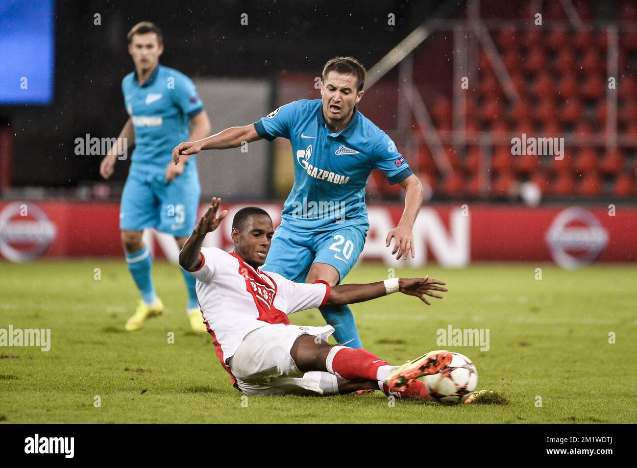 Standard's new player Ricardo Faty and Zenit's Viktor Fayzulin fight for the ball during the first leg match between Belgian first division soccer team Standard de Liege and Russian team FC Zenit Saint Petersburg in the playoffs for the UEFA Champions League competition, Wednesday 20 August 2014, in Liege. Stock Photo