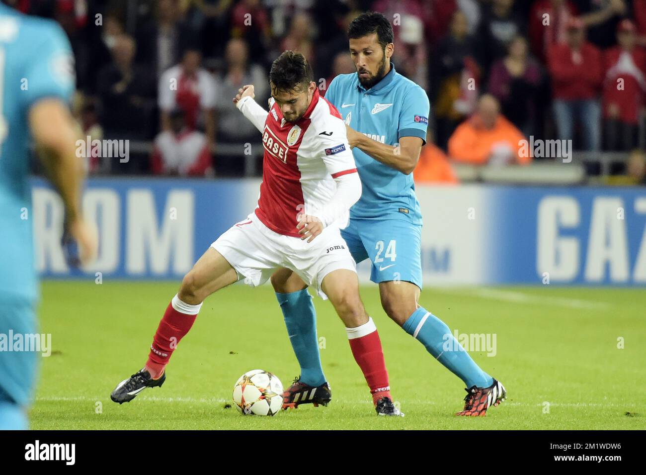 Standard's Tony Watt and Zenit's Ezequiel Garay fight for the ball during the first leg match between Belgian first division soccer team Standard de Liege and Russian team FC Zenit Saint Petersburg in the playoffs for the UEFA Champions League competition, Wednesday 20 August 2014, in Liege. Stock Photo