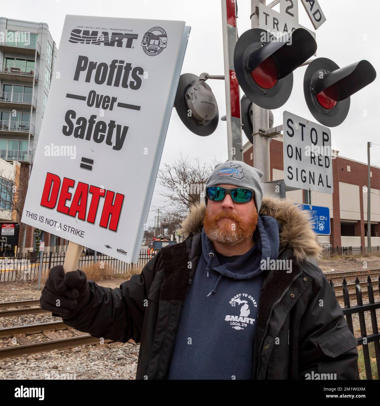 Royal Oak, Michigan, USA. 13th Dec, 2022. Railroad workers rally in suburban Detroit, upset that railroads are emphasizing profits over safety, and still angry that sick pay was not included in the contract that Congress forced on them earlier this month. It was one of a number of rallies held across the United States, organized by the SMART Transportation Division. Credit: Jim West/Alamy Live News Stock Photo