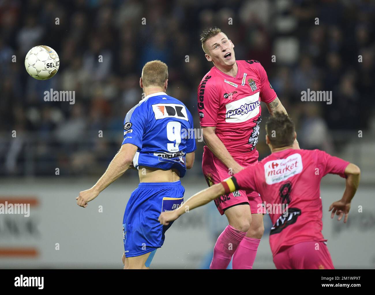 20141018 - GENT, BELGIUM: Charleroi's Clement Taimont and Gent's Laurent Depoitre fight for the ball during the Jupiler Pro League match between AA Gent and Charleroi, in Gent, Saturday 18 October 2014, on day 11 of the Belgian soccer championship. BELGA PHOTO JOHN THYS Stock Photo