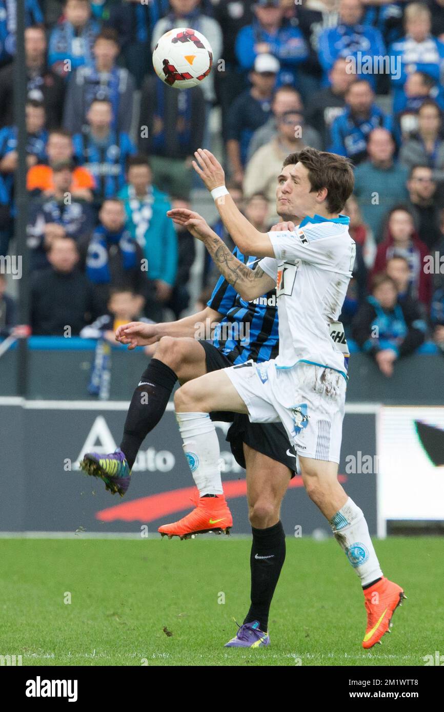 20141026 - BRUGGE, BELGIUM: Club's Thomas Meunier and Gent's Benito Raman fight for the ball during the Jupiler Pro League match between Club Brugge KV and KAA Gent, in Brugge, Sunday 26 October 2014, on day 12 of the Belgian soccer championship. BELGA PHOTO KURT DESPLENTER Stock Photo