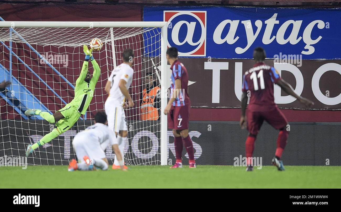 20141023 - TRABZON, TURKEY: Lokeren's goalkeeper Barry Boubacar Copa and Trabzonspor's Kevin Constant pictured in action during a game between Turkish club Trabzonspor AS and Belgian soccer team KSC Lokeren OVL in the Huseyin Avni Aker Stadium in Trabzon, Thursday 23 October 2014. It is the third day of the group stage of the UEFA Europa League competition, in group L. BELGA PHOTO YORICK JANSENS Stock Photo