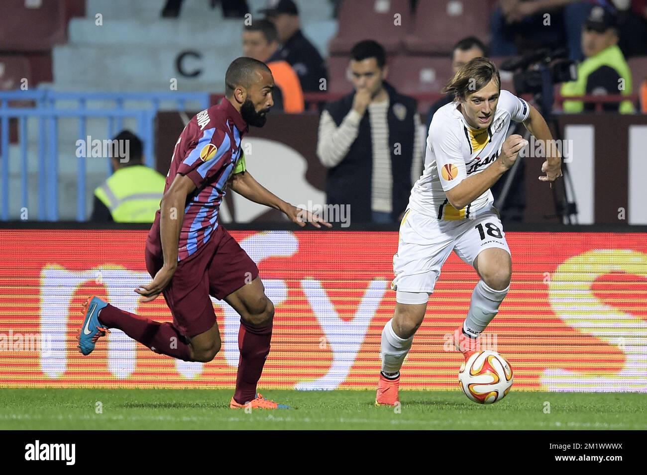 20141023 - TRABZON, TURKEY: Trabzonspor's Jose Bosingwa and Lokeren's Besart Abdurahimi fight for the ball during a game between Turkish club Trabzonspor AS and Belgian soccer team KSC Lokeren OVL in the Huseyin Avni Aker Stadium in Trabzon, Thursday 23 October 2014. It is the third day of the group stage of the UEFA Europa League competition, in group L. BELGA PHOTO YORICK JANSENS Stock Photo