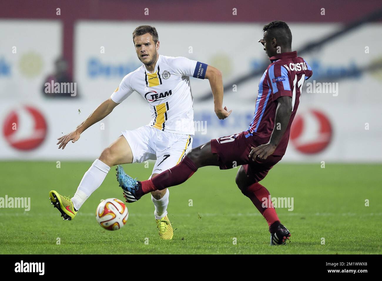 20141023 - TRABZON, TURKEY: Lokeren's Killian Overmeire and Trabzonspor's Kevin Constant fight for the ball during a game between Turkish club Trabzonspor AS and Belgian soccer team KSC Lokeren OVL in the Huseyin Avni Aker Stadium in Trabzon, Thursday 23 October 2014. It is the third day of the group stage of the UEFA Europa League competition, in group L. BELGA PHOTO YORICK JANSENS Stock Photo