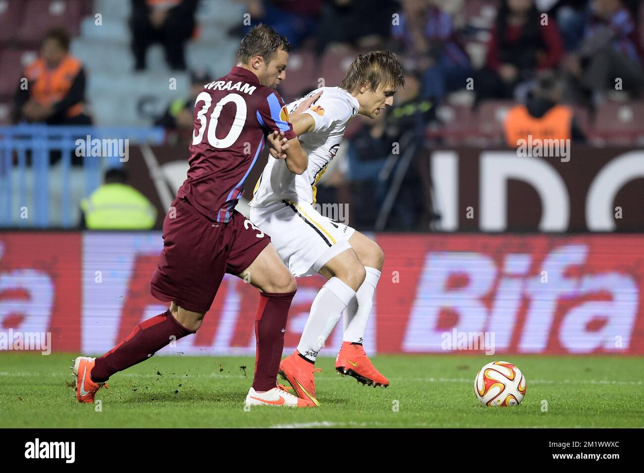 20141023 - TRABZON, TURKEY: Trabzonspor's Avraam Papadopoulos and Lokeren's Besart Abdurahimi fight for the ball during a game between Turkish club Trabzonspor AS and Belgian soccer team KSC Lokeren OVL in the Huseyin Avni Aker Stadium in Trabzon, Thursday 23 October 2014. It is the third day of the group stage of the UEFA Europa League competition, in group L. BELGA PHOTO YORICK JANSENS Stock Photo