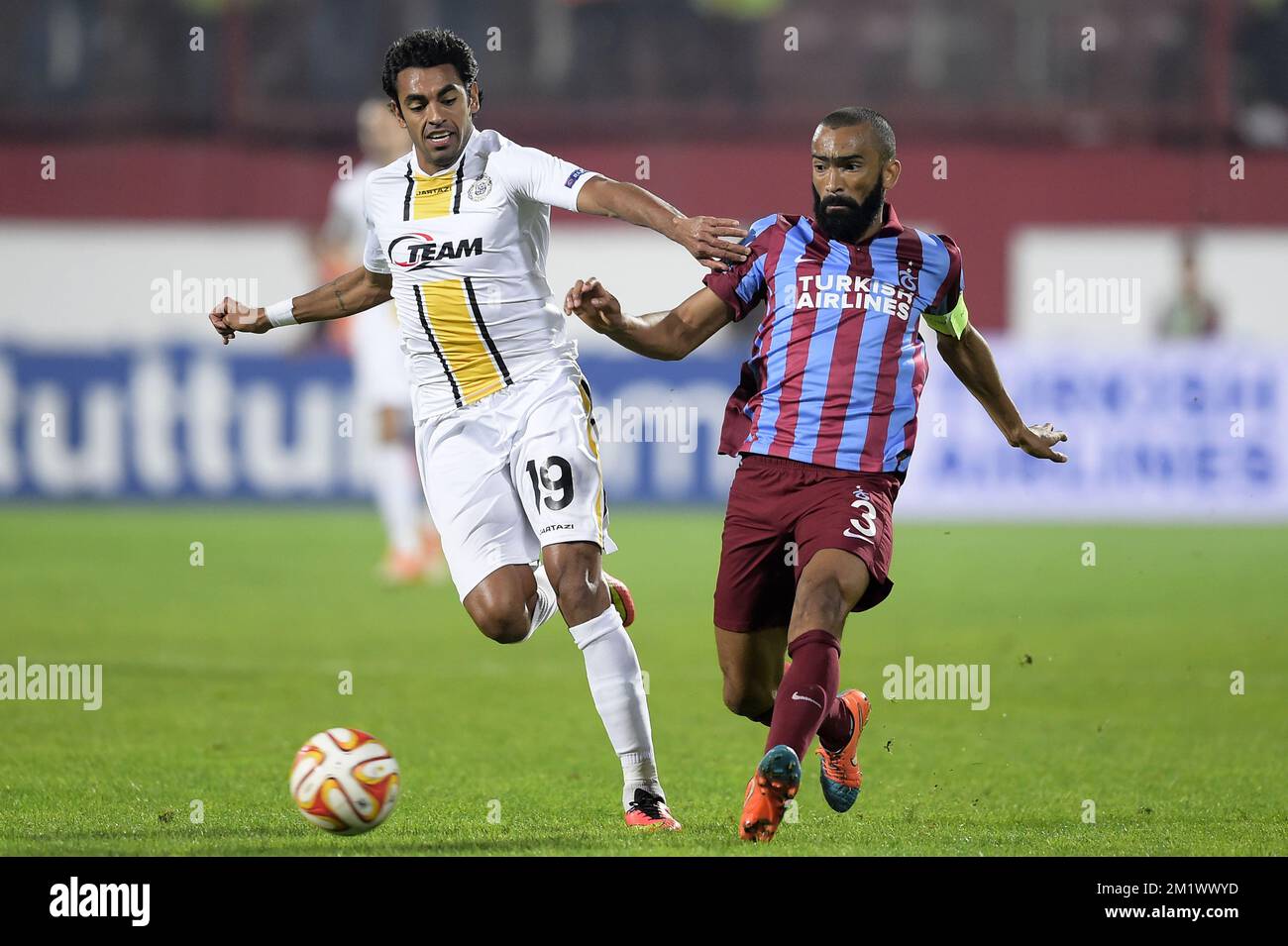 20141023 - TRABZON, TURKEY: Lokeren's Sergio Junior Dutra and Trabzonspor's Jose Bosingwa fight for the ball during a game between Turkish club Trabzonspor AS and Belgian soccer team KSC Lokeren OVL in the Huseyin Avni Aker Stadium in Trabzon, Thursday 23 October 2014. It is the third day of the group stage of the UEFA Europa League competition, in group L. BELGA PHOTO YORICK JANSENS Stock Photo