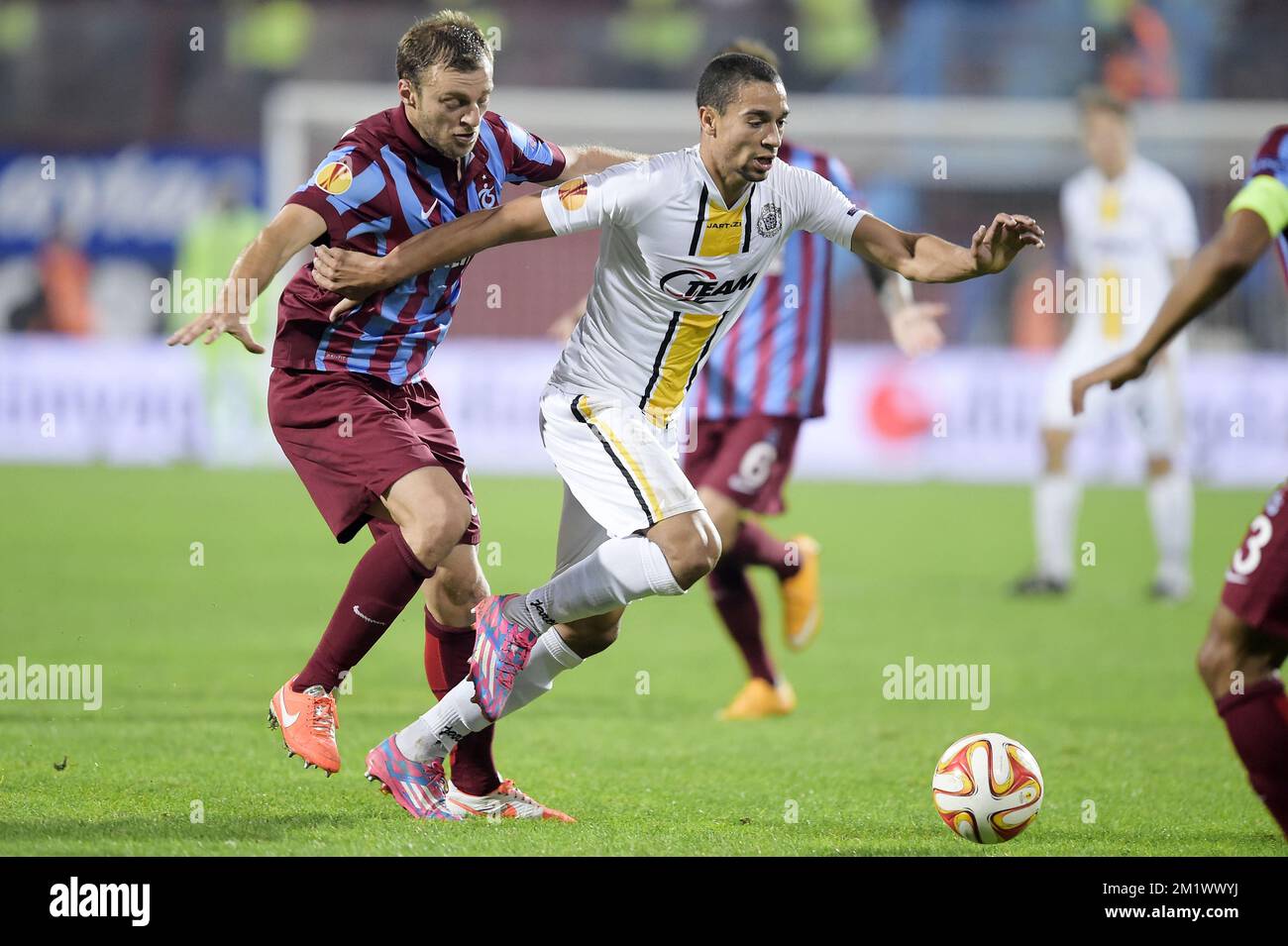 20141023 - TRABZON, TURKEY: Trabzonspor's Avraam Papadopoulos and Lokeren's Nill De Pauw fight for the ball during a game between Turkish club Trabzonspor AS and Belgian soccer team KSC Lokeren OVL in the Huseyin Avni Aker Stadium in Trabzon, Thursday 23 October 2014. It is the third day of the group stage of the UEFA Europa League competition, in group L. BELGA PHOTO YORICK JANSENS Stock Photo