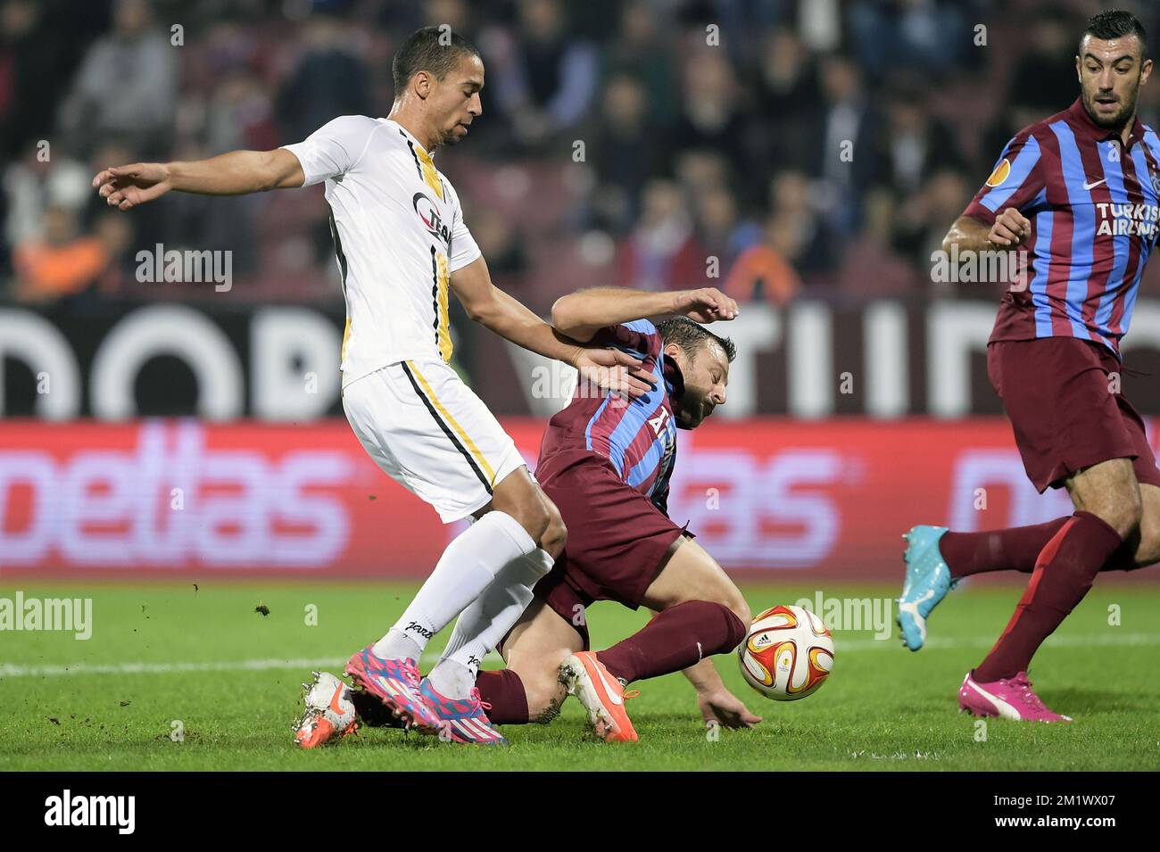20141023 - TRABZON, TURKEY: Lokeren's Nill De Pauw and Trabzonspor's Avraam Papadopoulos fight for the ball during a game between Turkish club Trabzonspor AS and Belgian soccer team KSC Lokeren OVL in the Huseyin Avni Aker Stadium in Trabzon, Thursday 23 October 2014. It is the third day of the group stage of the UEFA Europa League competition, in group L. BELGA PHOTO YORICK JANSENS Stock Photo