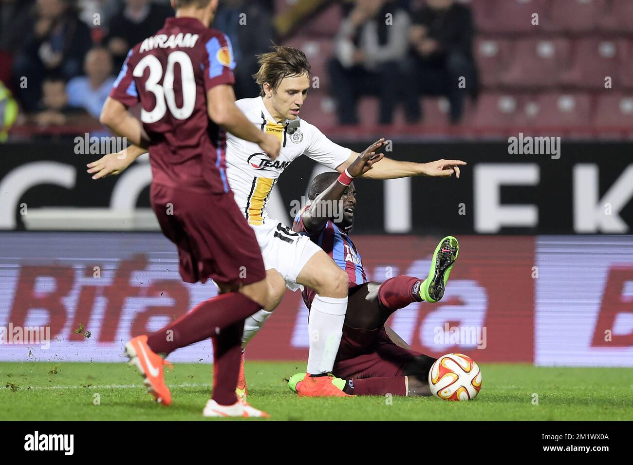 20141023 - TRABZON, TURKEY: Lokeren's Besart Abdurahimi and Trabzonspor's Ishak Dogan fight for the ball during a game between Turkish club Trabzonspor AS and Belgian soccer team KSC Lokeren OVL in the Huseyin Avni Aker Stadium in Trabzon, Thursday 23 October 2014. It is the third day of the group stage of the UEFA Europa League competition, in group L. BELGA PHOTO YORICK JANSENS Stock Photo