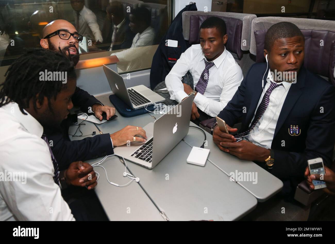 20141103 - BRUSSELS, BELGIUM: (L-R) 42 Anderlecht's Nathan Kabasele, Anderlecht's Anthony Vanden Borre, Anderlecht's Andy Kawaya and Anderlecht's Chancel Mbemba pictured at the departure of Belgian soccer team RSCA Anderlecht in Brussels South station (Midi - Zuid), on the way to England with Eurostar, Monday 03 November 2014. Tomorrow Anderlecht is playing English team Arsenal in the fourth day of the group stage of the UEFA Champions League competition, in the group D. BELGA PHOTO VIRGINIE LEFOUR Stock Photo