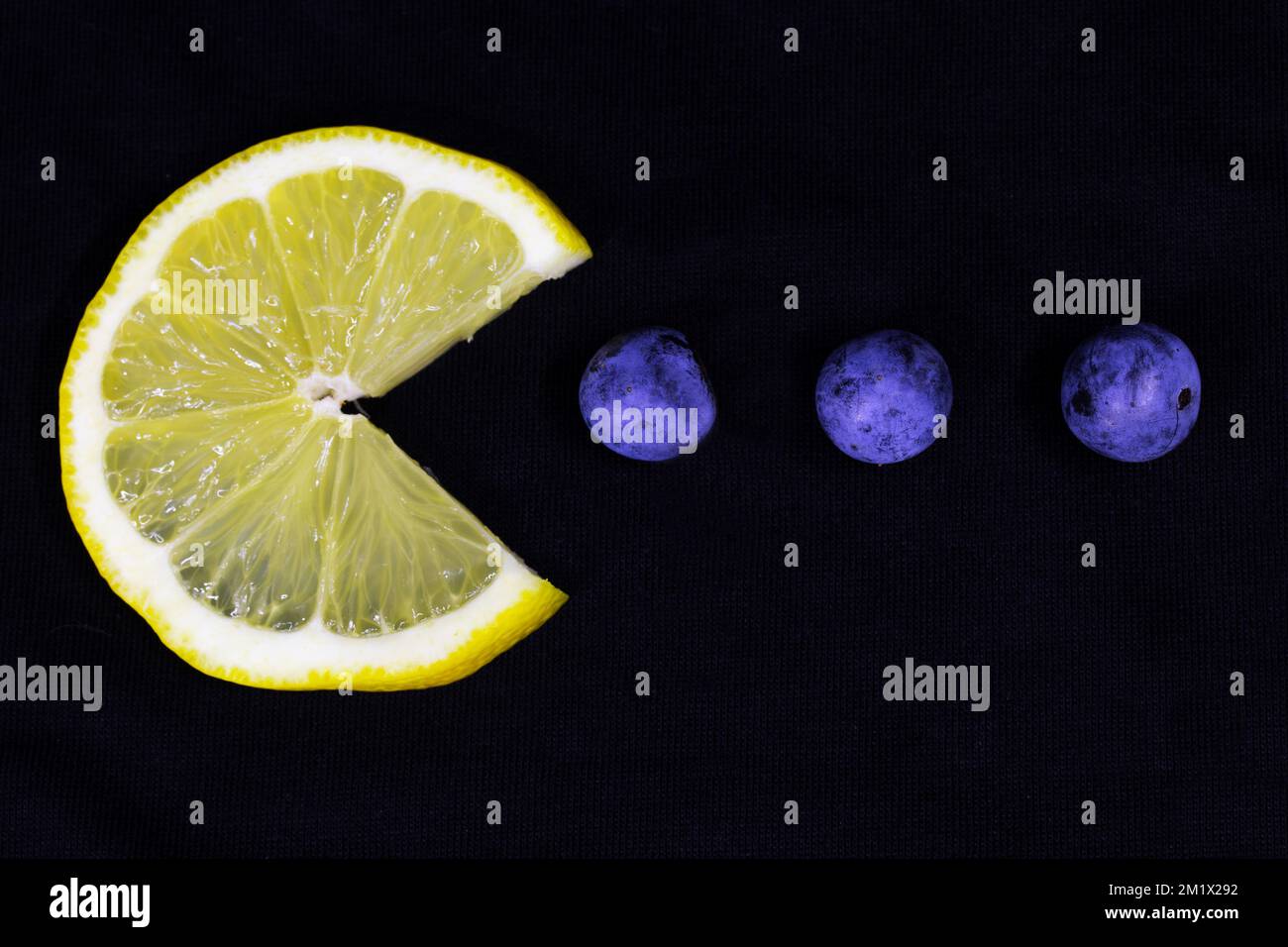 lemon wedge that simulates the famous video game Stock Photo