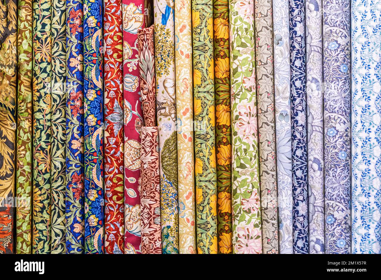 Multicolored fabric samples in atelier, store, factory. Sewing clothes, manufacturing, clothing industry hobby Stock Photo
