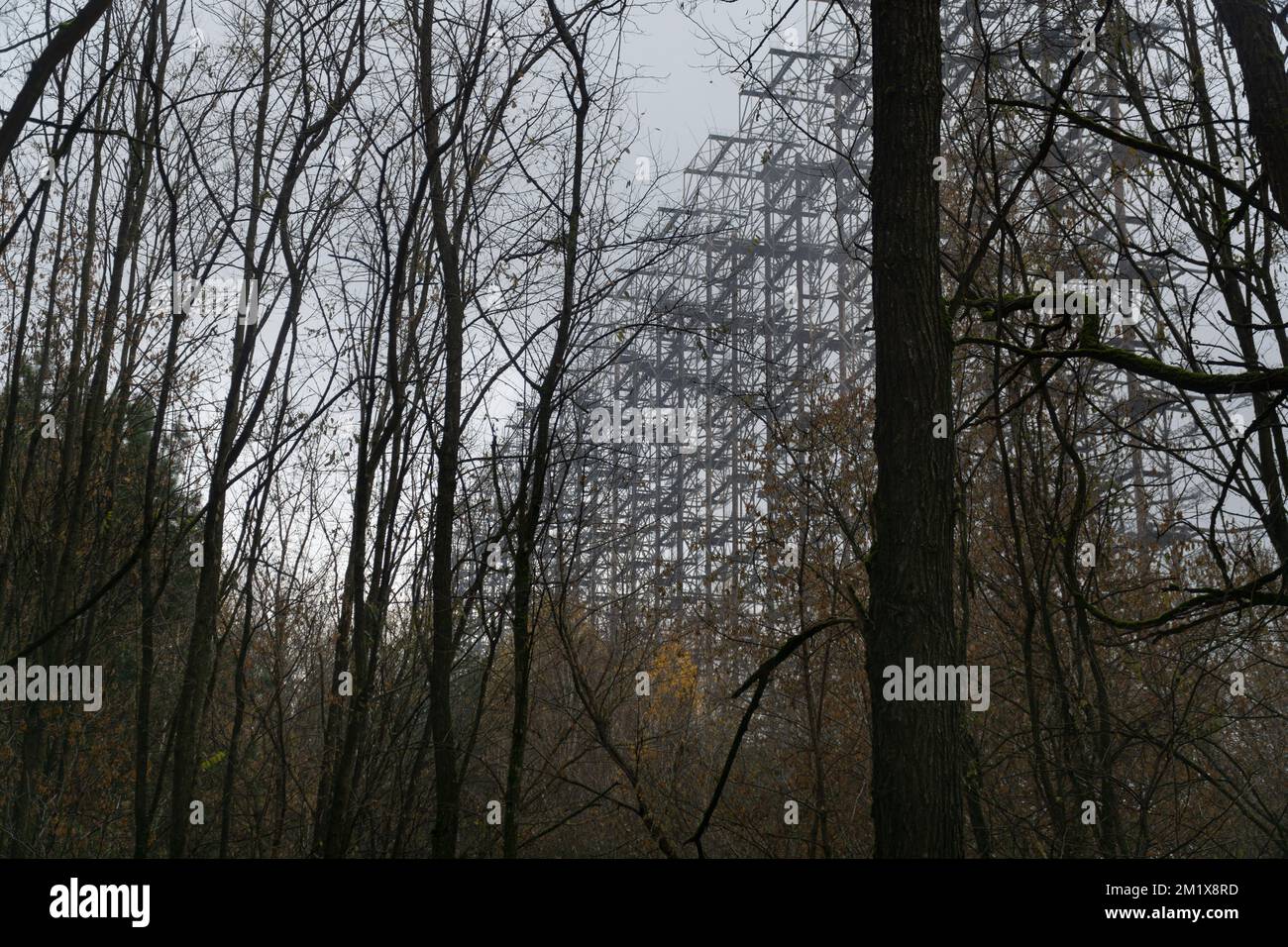 OTH anti air missile defense system viewed through a high branched trees at chernobyl nuclear disaster exclusion zone Stock Photo