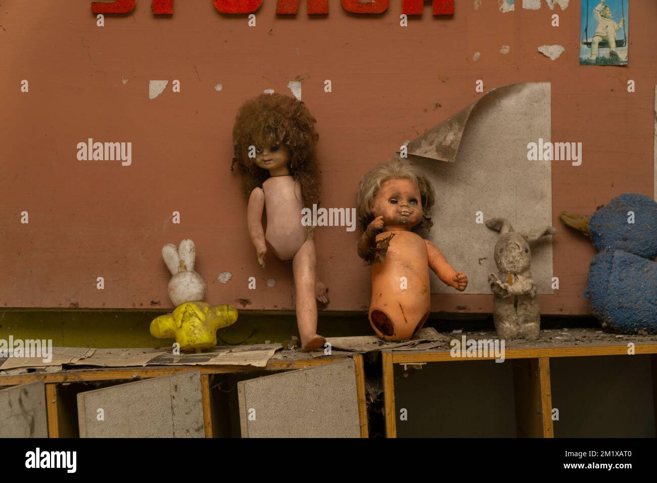 Stuffed plush toys and dolls, Cheburashka on a shelf in a closet in a  destroyed kindergarten in Pripyat, in the Chernobyl exclusion zone, Ukraine  Stock Photo - Alamy