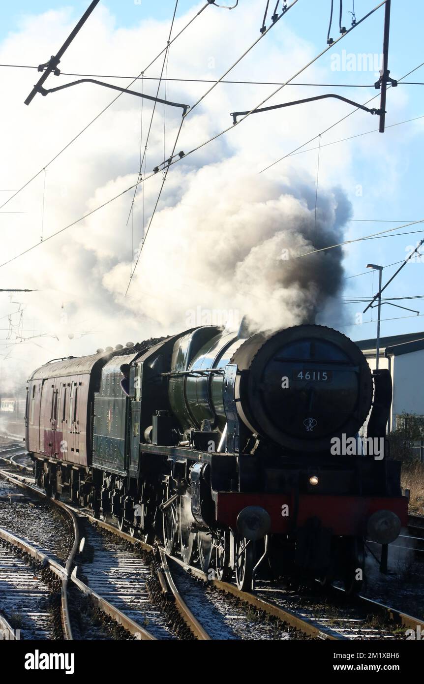 Preserved Royal Scot class steam train, 46115 Scots Guardsman, setting off from Carnforth on 9th December 2022. Stock Photo