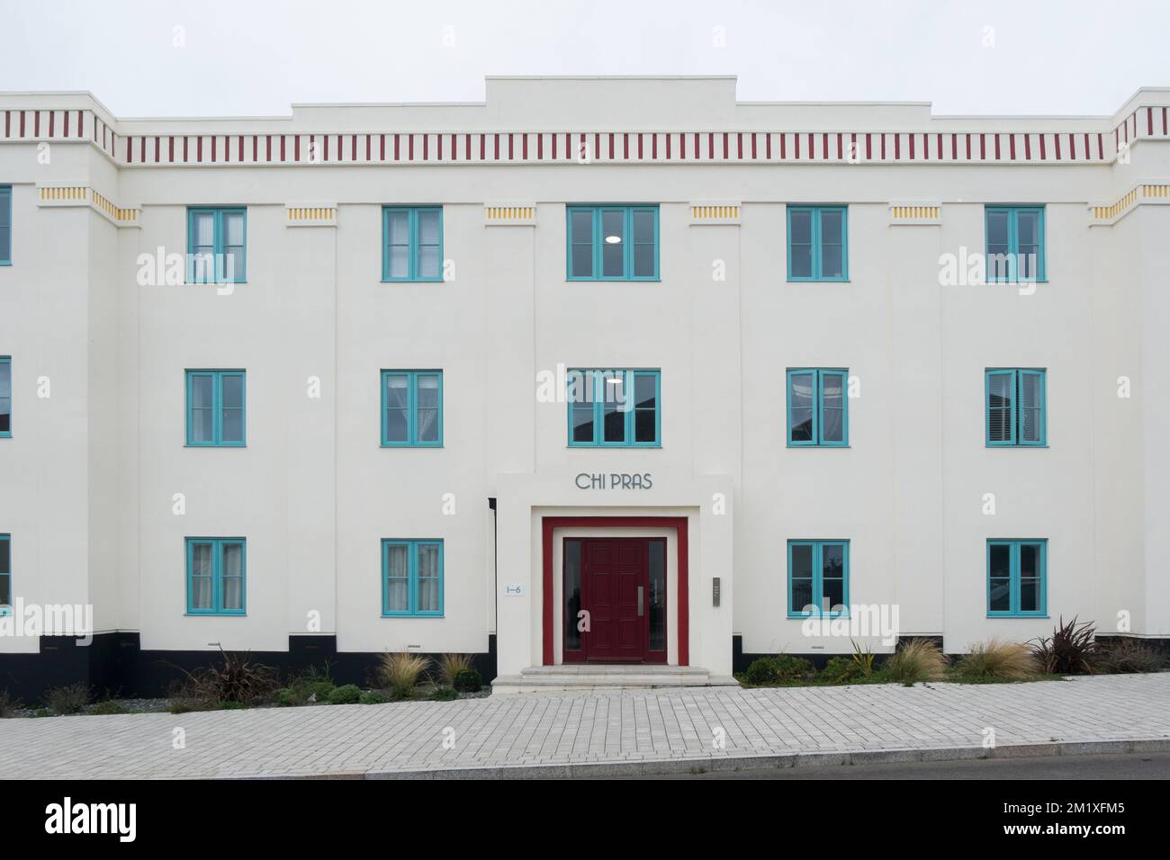 The 1930s style apartment block Chi Pras on Stret Kosti Veur Woles in Nansledan, a development by the Duchy of Cornwall in Newquay, South West England Stock Photo