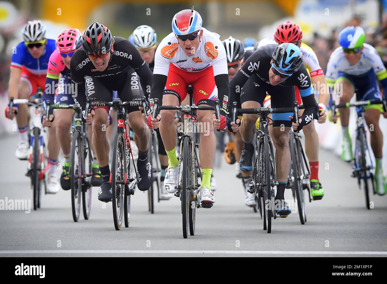 20150331 - ZOTTEGEM, BELGIUM: Norwegian Alexander Kristoff of Team Katusha wins before Italian Elia Viviani of Team Sky (R) and New Zealand's Shane Archbold of Bora-Argon 18 (L) during the second stage of the Driedaagse De Panne - Koksijde cycling race, 201,6 km from De Panne to Zottegem, Tuesday 31 March 2015. BELGA PHOTO POOL Stock Photo