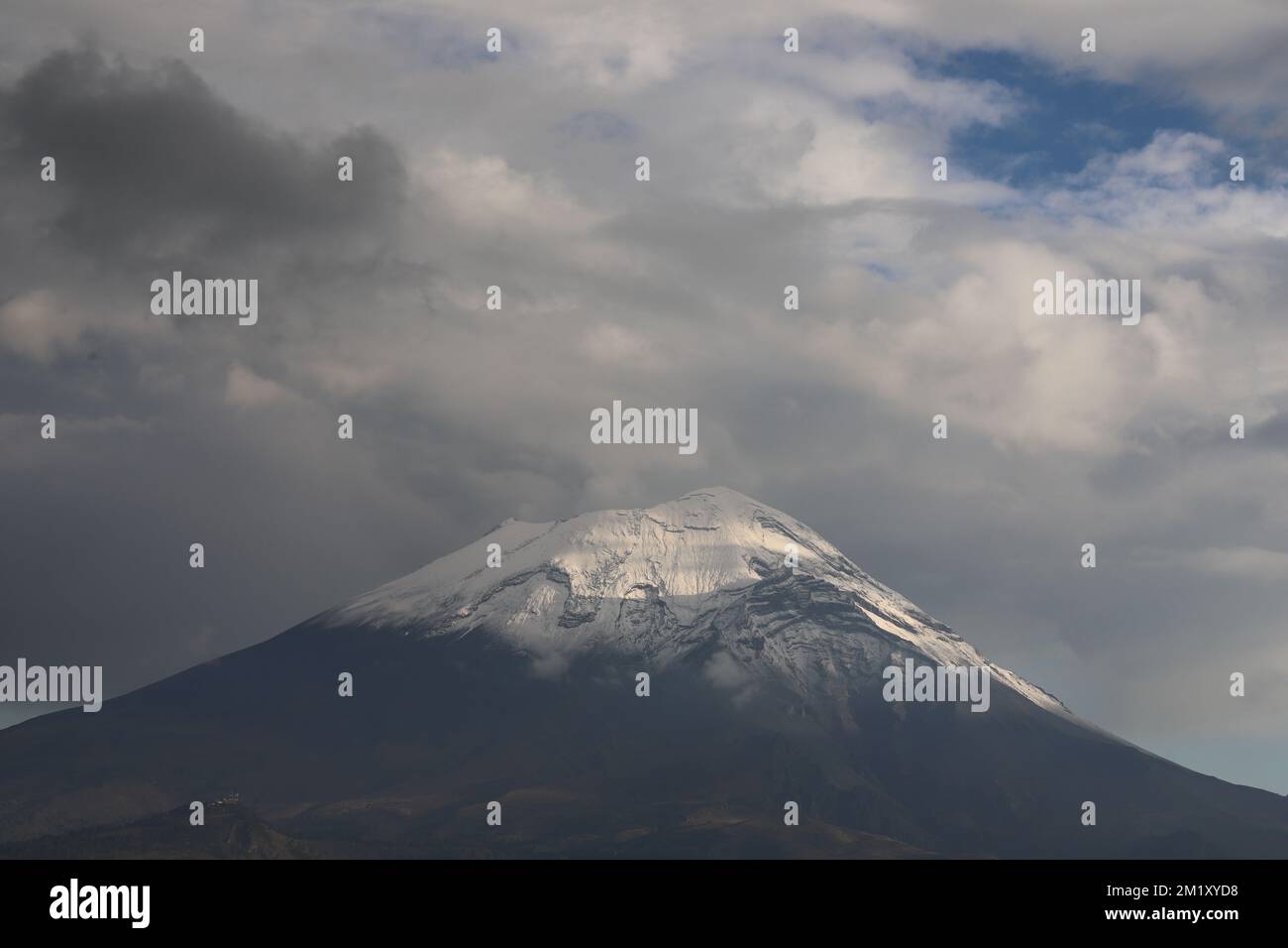A landscape view Popocatepetl volcano with cloudy sky background Stock  Photo - Alamy