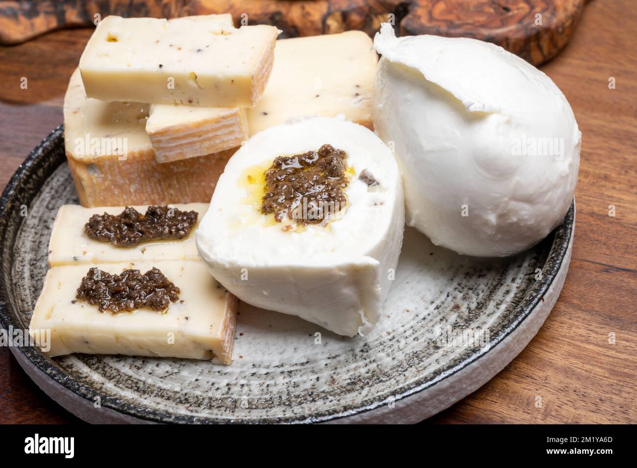 Italian cheese collection, yellow taleggio cheese and white mozzarella