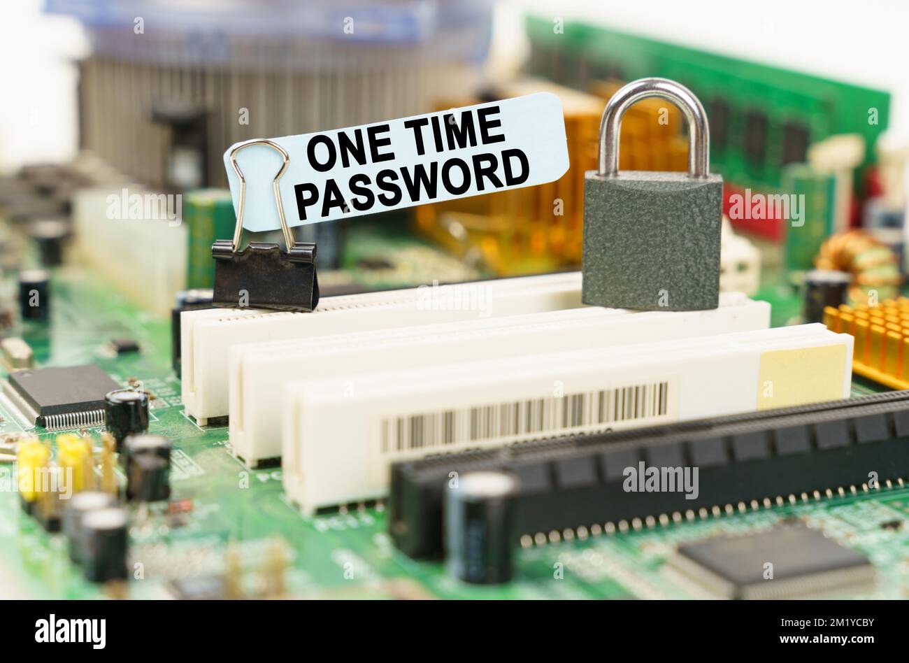 Computer security concept. There is a sticker on the motherboard that says - One Time Password Stock Photo