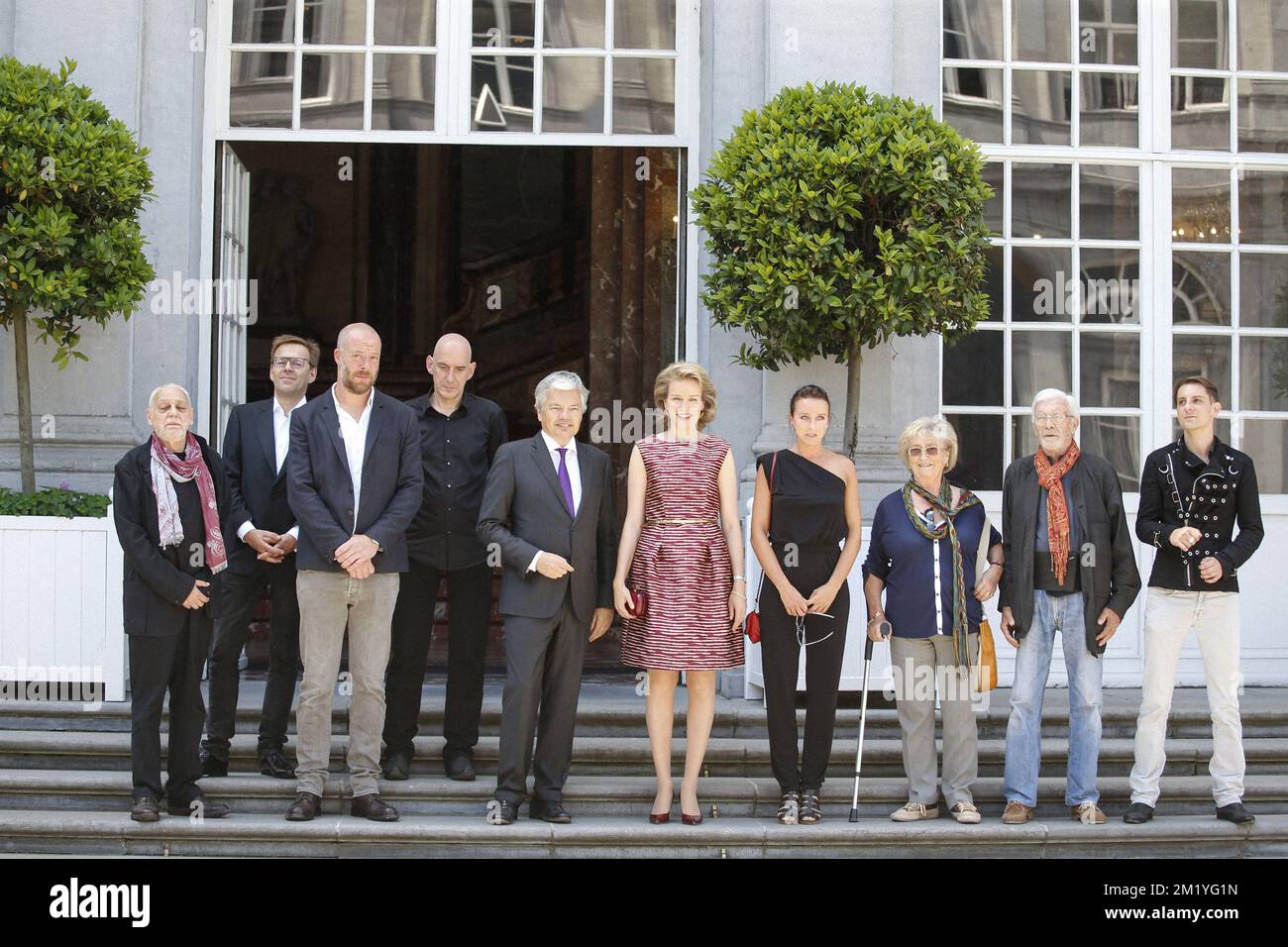 Paul De Vylder, Wim Delvoye, Stephane Halleux, Johan Muyle, MR Vice-Prime Minister and Foreign Minister Didier Reynders, Queen Mathilde of Belgium, Nadia Naveau, unidentified woman and man and Michael Aerts pictured during the inauguration of the exhibition '@yourservice', organized by the Belgian Foreign Affairs at the Egmont Palace in Brussels on the occasion of the National Day, Friday 17 July 2015. BELGA PHOTO THIERRY ROGE Stock Photo
