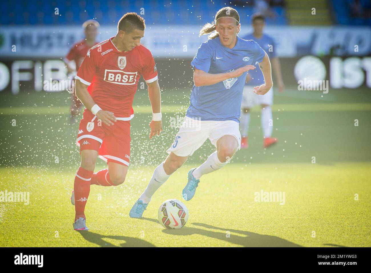 Standard's Anthony Knockaert and Molde's Per Egil Flo fight for the ball  during the first leg game of the play-offs in the Uefa Europa League  competition between Norwegian team Molde and Belgian