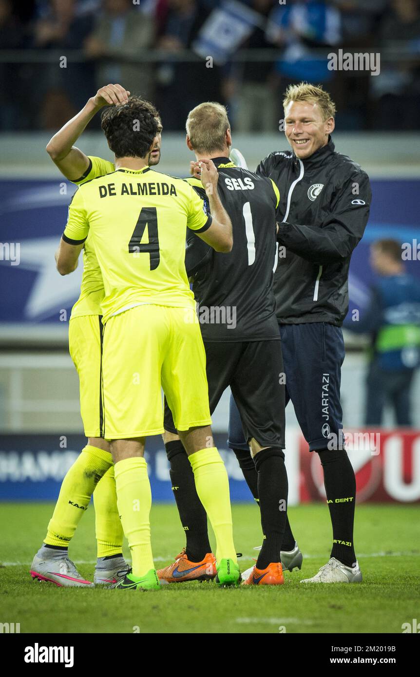 20150916 - GENT, BELGIUM: Gent's 'Rafinha' Rafael Scapini de Almeida, Gent's goalkeeper Matz Sels and Gent's goalkeeper Brian Vandenbussche celebrate after the first game in the group stage of the Uefa Champions League competition, in group H, between Belgian first league soccer team KAA Gent and Olympique Lyon, in Gent, Wednesday 16 September 2015. BELGA PHOTO JASPER JACOBS Stock Photo