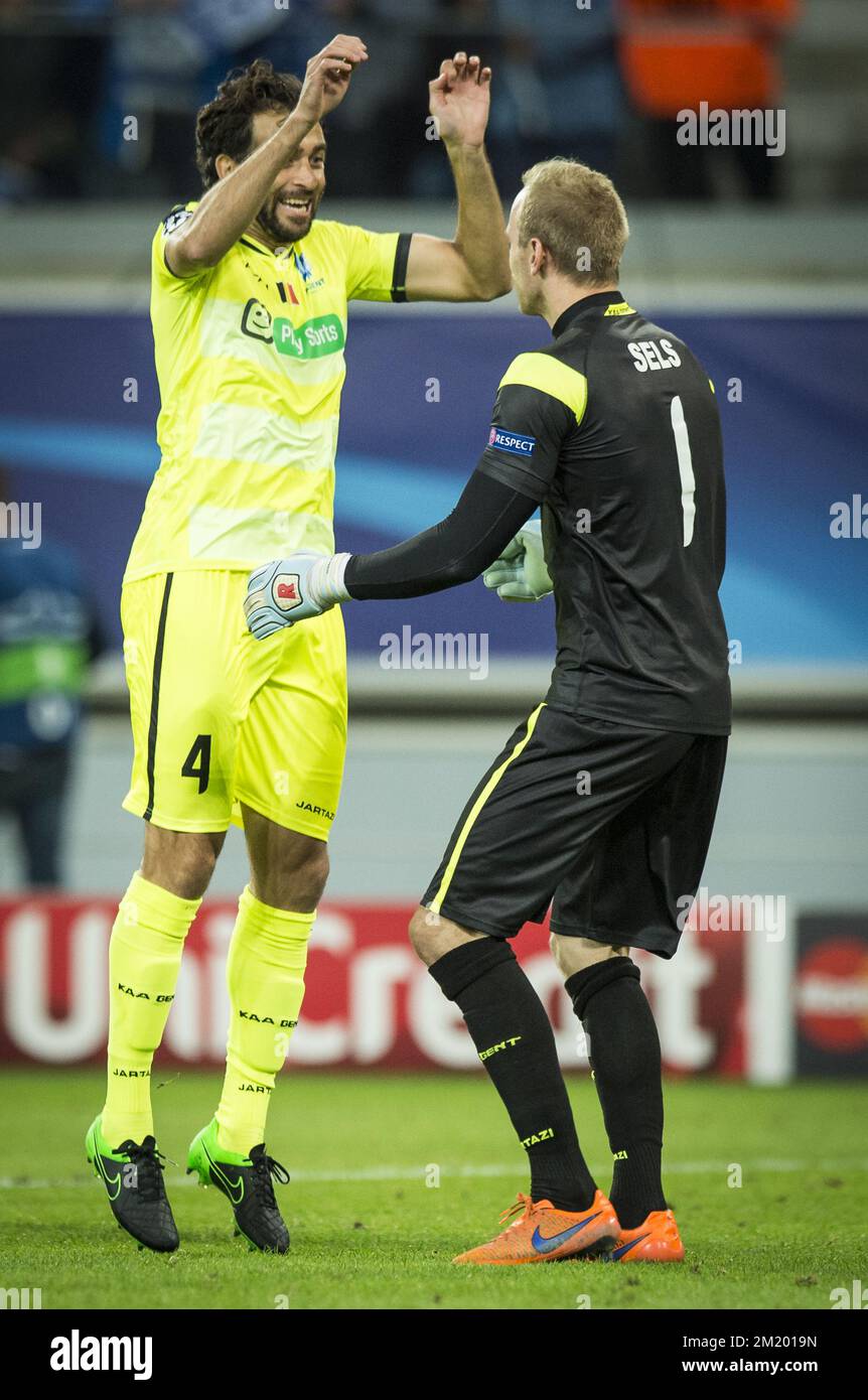 20150916 - GENT, BELGIUM: Gent's 'Rafinha' Rafael Scapini de Almeida and Gent's goalkeeper Matz Sels celebrate after the first game in the group stage of the Uefa Champions League competition, in group H, between Belgian first league soccer team KAA Gent and Olympique Lyon, in Gent, Wednesday 16 September 2015. BELGA PHOTO JASPER JACOBS Stock Photo