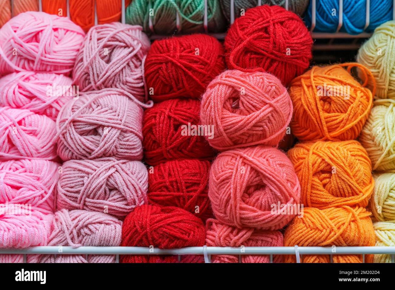 Fluffy skeins of colorful fluffy yarn , yarn for knitting, shelf in