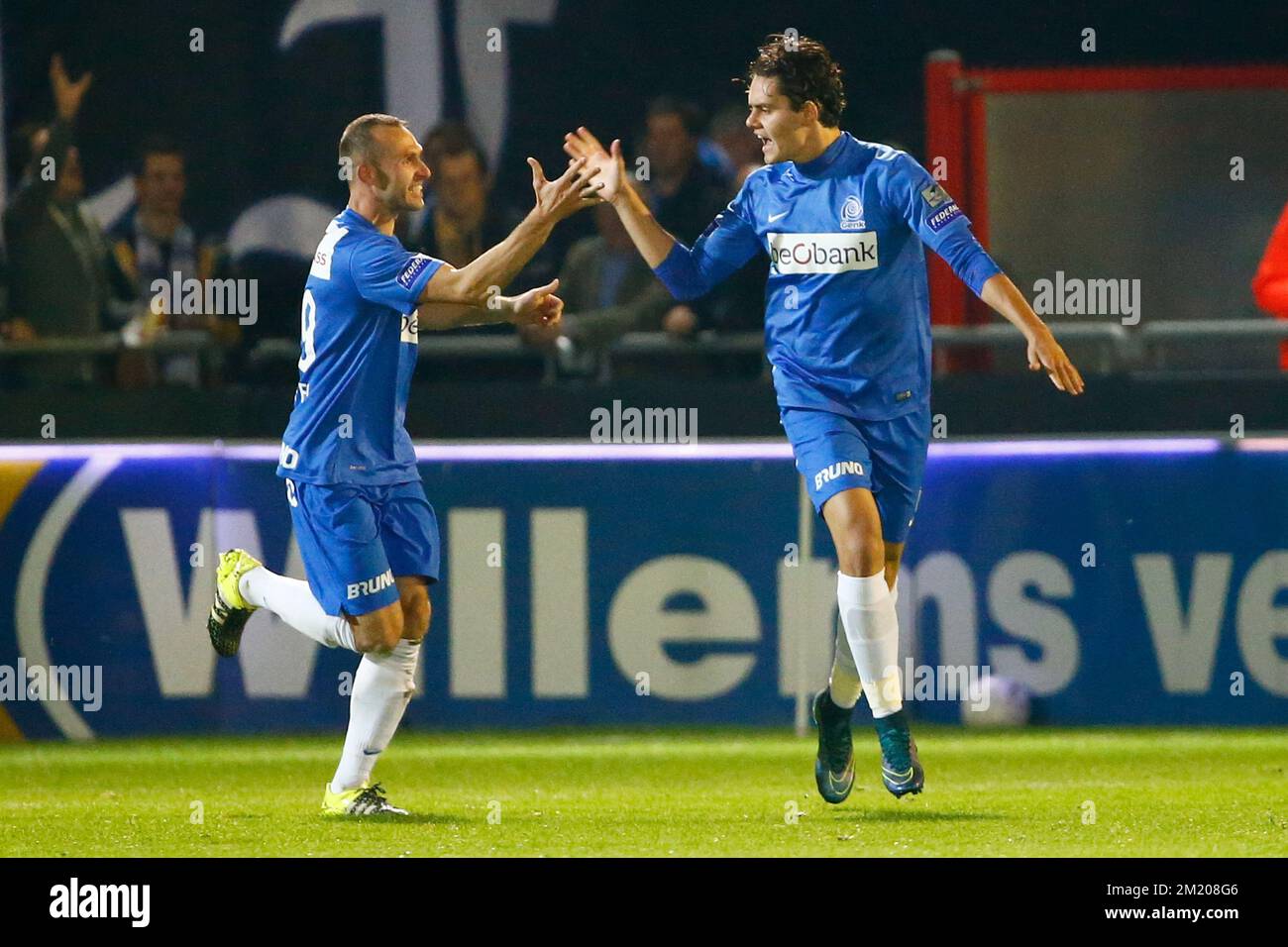 20151027 - OOSTENDE, BELGIUM: Genk's Thomas Buffel and Genk's Enes Unal celebrate after scoring during the Jupiler Pro League match between KV Oostende and RC Genk, in Oostende, Tuesday 27 October 2015, on day 13 of the Belgian soccer championship. BELGA PHOTO KURT DESPLENTER Stock Photo