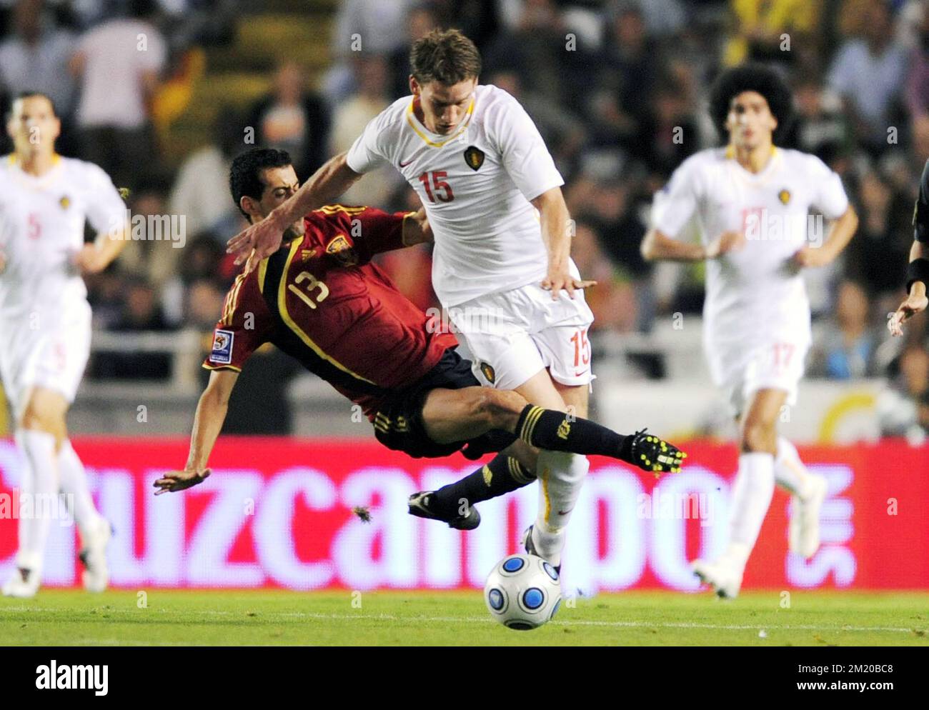 20090905 - LA CORUNA, SPAIN: (L-R) Spain's Sergio Busquets and Belgium's Jan Vertonghen fight for the ball during the qualification match Spain vs Belgium, for the South Africa 2010 Soccer World Championships, Saturday 05 September 2009, at the Riazor stadium in La Coruna, Spain.  Stock Photo