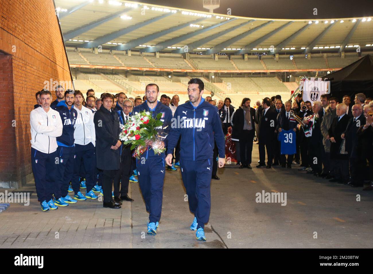 20151112 - BRUSSELS, BELGIUM: Italy's defender Giorgio Chiellini and Italy's goalkeeper Gianluigi Buffon put down flowers during a tribute to commemorate the Heysel stadium disaster 30 years ago, in Brussels former Heysel stadium, now called King Baudouin stadium (Stade Roi Baudouin - Koning Boudewijnsatdion), Thursday 12 November 2015. On 29 May 1985, 39 persons because of clashes between supporters and the collapse of a part of a stand, before the start of the European Cup final between Liverpool and Juventus. Red Devils Belgian national team is playing a friendly games against Italy tomorro Stock Photo