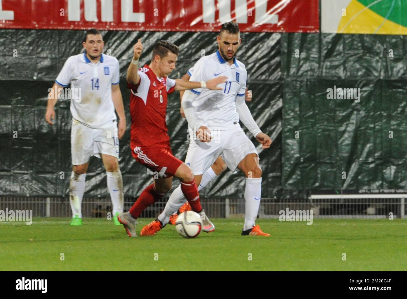 20151113 - DIFFERDANGE, LUXEMBOURG: Luxembourg's Chris Philipps and Greece's Panagiotis Tachtsidis fight for the ball during a friendly soccer game between Luxembourg national team and Greece, in Differdange, Luxembourg, Friday 13 November 2015. BELGA PHOTO SOPHIE KIP Stock Photo