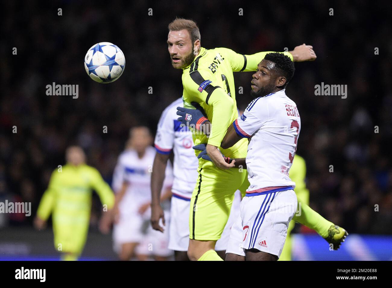 20151124 - LYON, FRANCE: Gent's Laurent Depoitre and Lyon's Henri Bedimo fight for the ball during the game between French club Olympique Lyonnais and Belgian first league soccer team KAA Gent, the fifth game in the group H, in the group stage of the Uefa Champions League competition, in Lyon, France, Tuesday 24 November 2015. BELGA PHOTO YORICK JANSENS Stock Photo