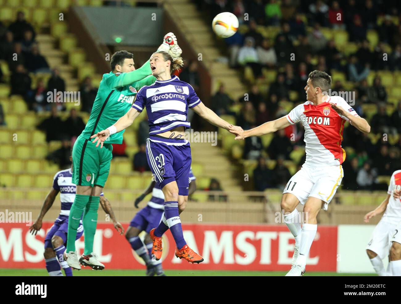 20151126 - MONACO, MONACO: Monaco's goalkeeper Danijel Subasic and Anderlecht's Guillaume Gillet fight for the ball during a game between French club AS Monaco and Belgian first league soccer club RSC Anderlecht, in Monaco, Thursday 26 November 2015. It's the fifth game in the group stage of the Uefa Europa League competition, in the group J. BELGA PHOTO VIRGINIE LEFOUR Stock Photo