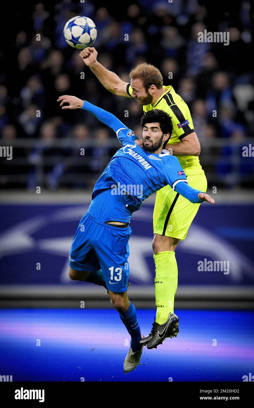 20151209 - GENT, BELGIUM: Zenit's Luis Neto and Gent's Laurent Depoitre fight for the ball during a soccer game between Belgian team KAA Gent and Russian club FC Zenit Saint Petersburg, Wednesday 09 December 2015, in Gent, the sixth and last day of the group stage the UEFA Champions League competition, in group H. BELGA PHOTO YORICK JANSENS Stock Photo
