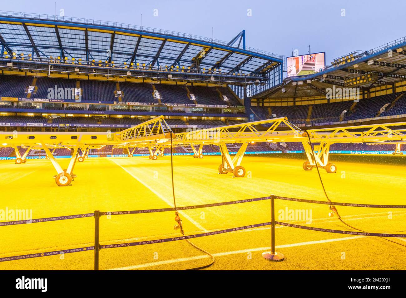 Pitch of Stamford Bridge Stadium under artificial lights Stock Photo