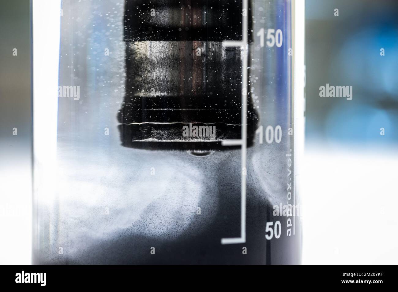 Iron nanoparticles in a lab, on a white glossy surface Stock Photo