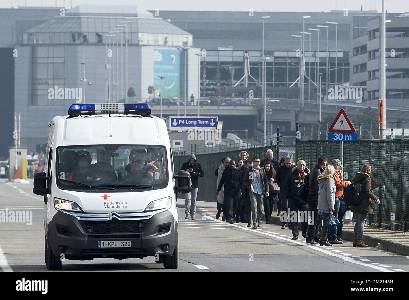 People are evacuated from Brussels Airport, in Zaventem, Tuesday 22 March  2016. Two explosions in the departure hall of Brussels Airport this morning  took the lives of 14 people, 81 got injured., image size:1300x955