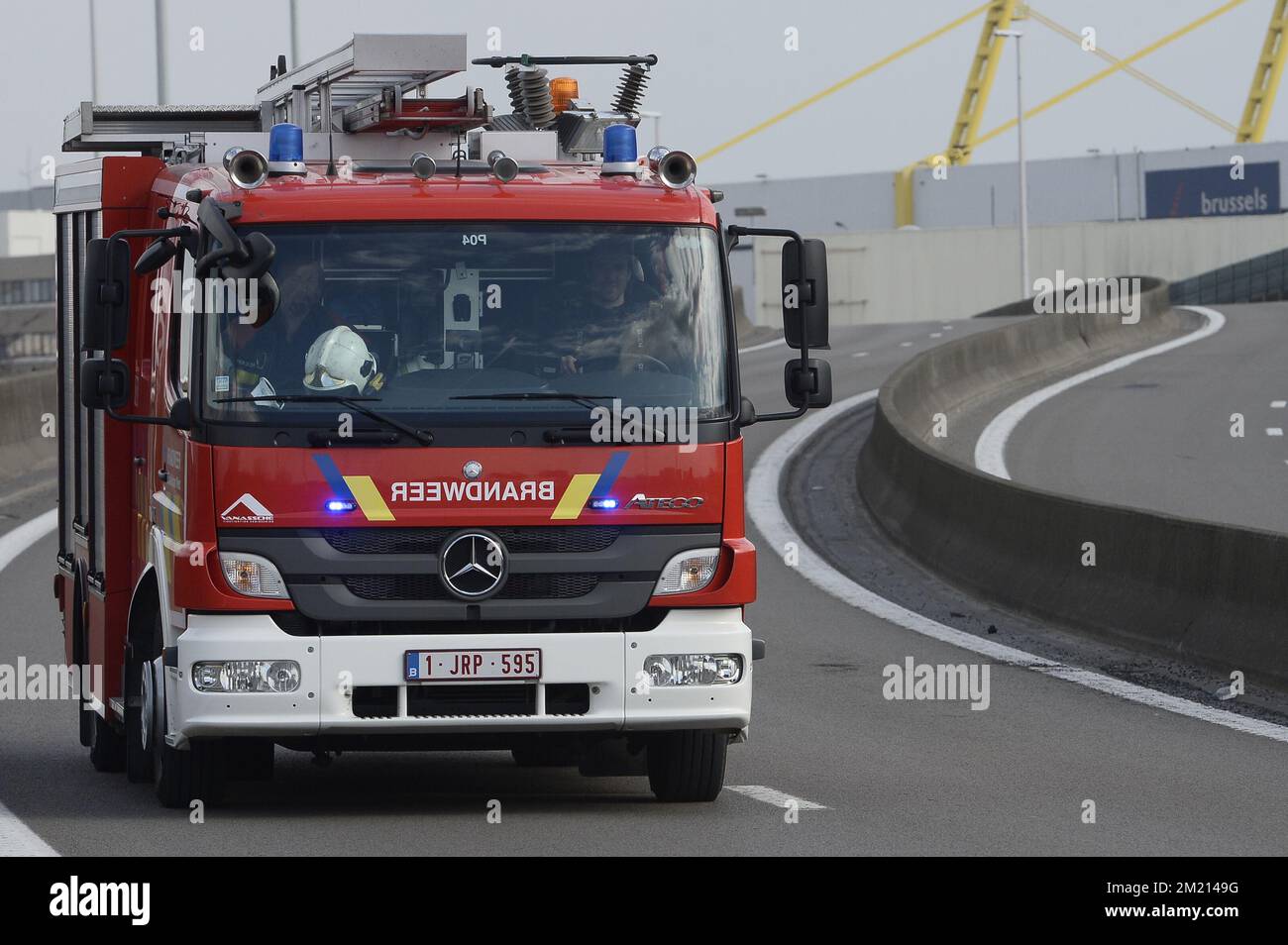 A firetruck leaves Brussels Airport, in Zaventem, Tuesday 22 March 2016.  Two explosions in the departure hall of Brussels Airport this morning took  the lives of 14 people, 81 got injured. Another, image size:1300x954