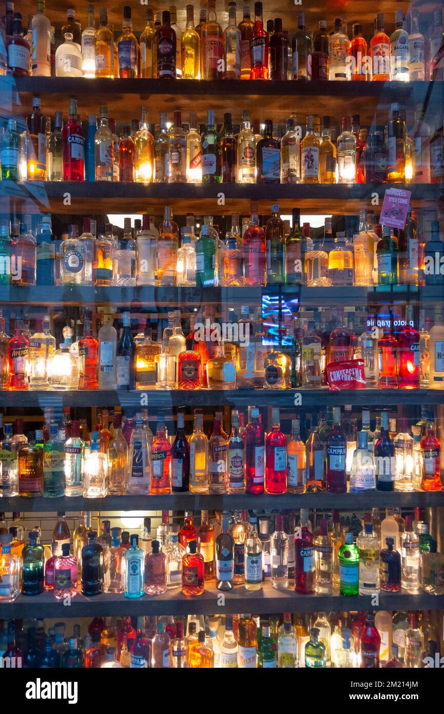 Bottles in the window of a bar in Paris Stock Photo